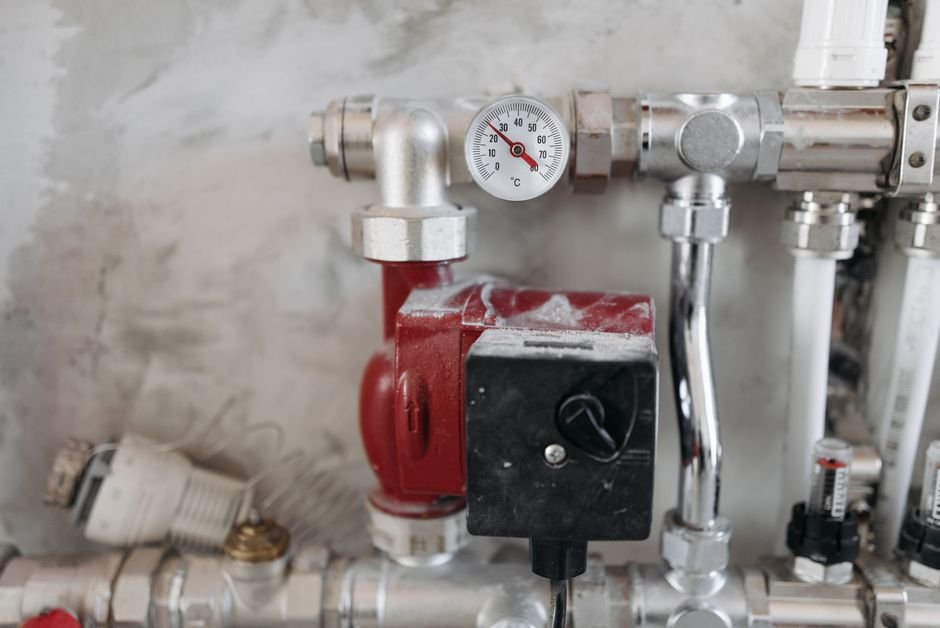 Close-up of a pressure gauge on gas pipework — the kind of installation a Gas Safe engineer checks when issuing a CP12 in Glasgow