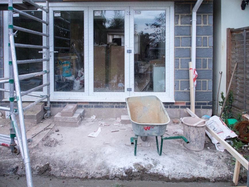 House renovation project with scaffolding and tools, the kind of extension or refurbishment job Ayrshire builders take on