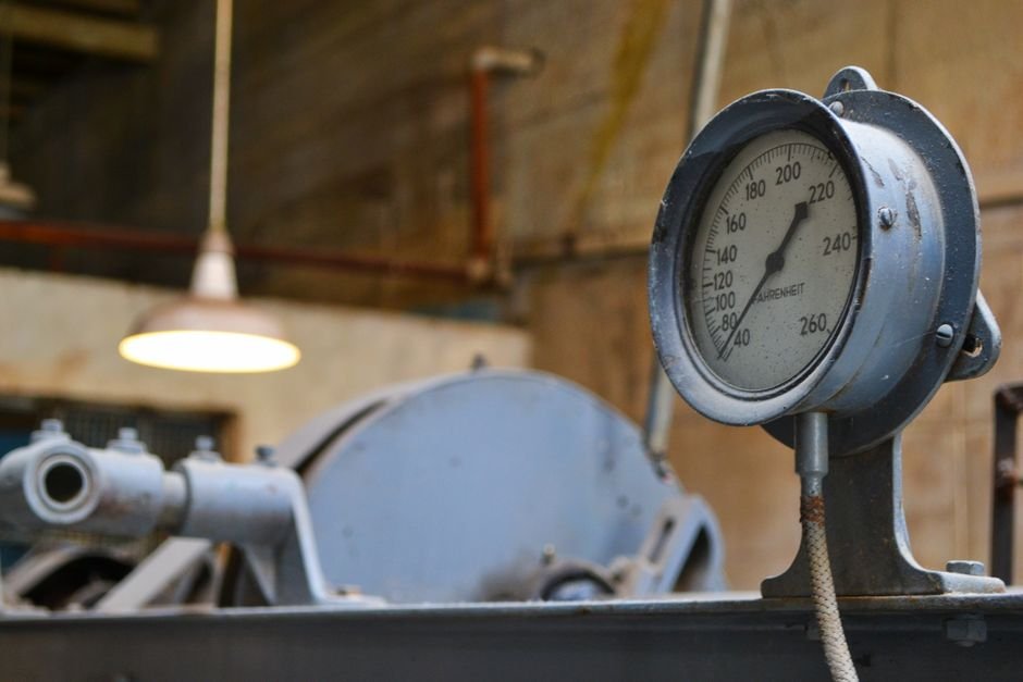Close-up of an analogue pressure gauge dial, the kind worth checking first when a boiler loses heat