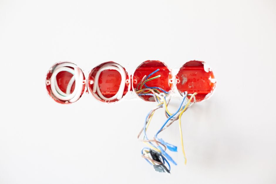 Electrician wiring wall sockets during an installation in Kilmarnock