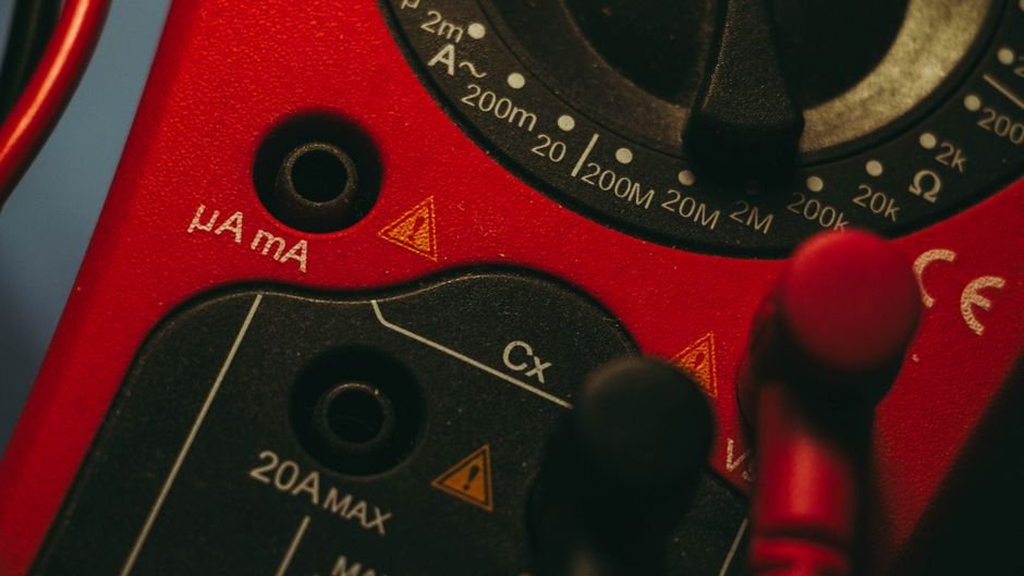 Close-up of a multimeter used by an electrician to test wiring and circuits during a safety check