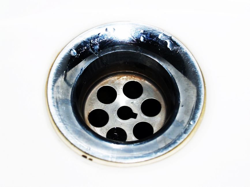Chrome sink drain and plumbing fitting in a Newton Mearns home