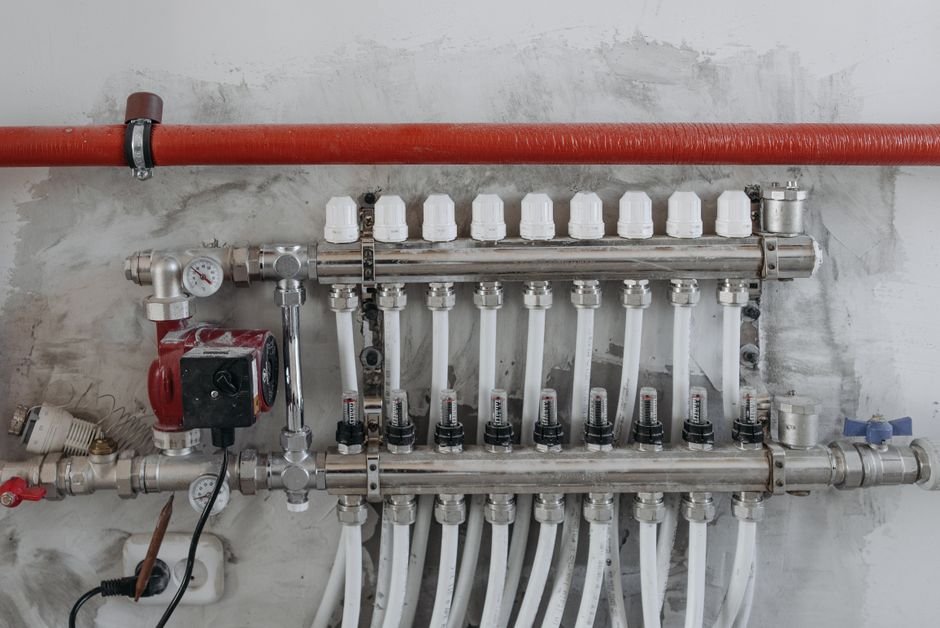 Steel central heating pipes and manifold, the kind of pipework a Gas Safe engineer checks during a boiler repair in Springburn