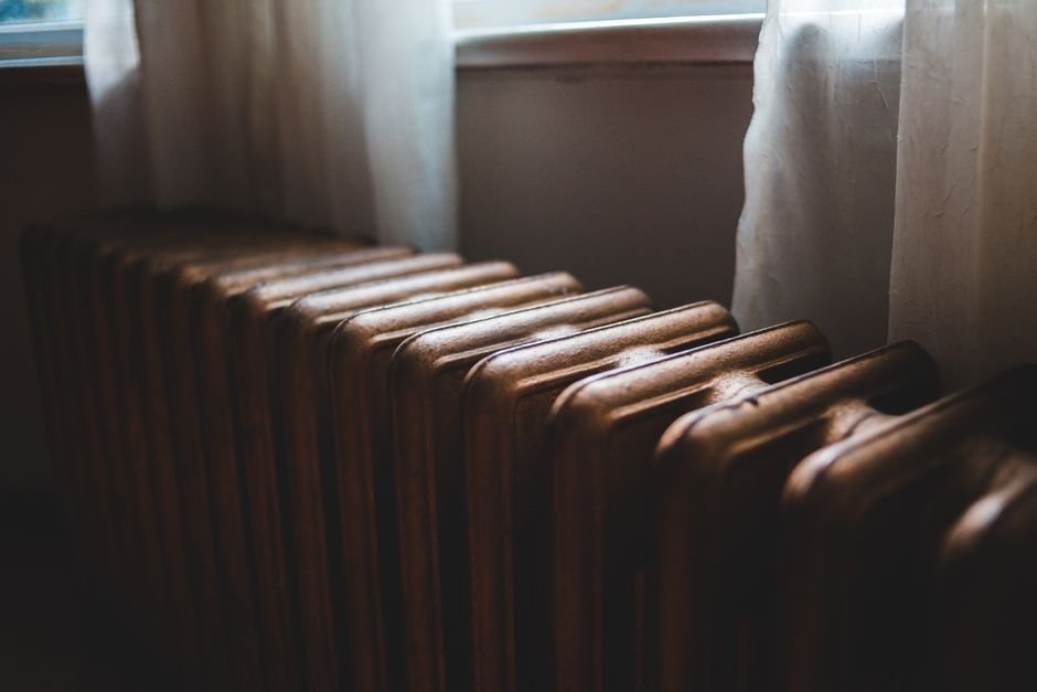 Cast-iron central heating radiator on a wall in a Troon home